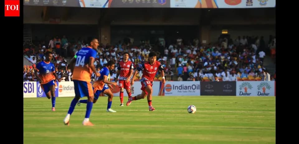 Players competing for the ball during football match