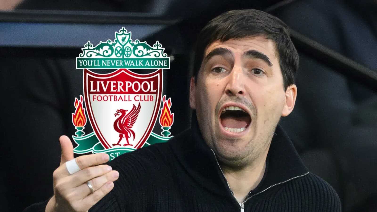 Person gesturing passionately near Liverpool FC logo