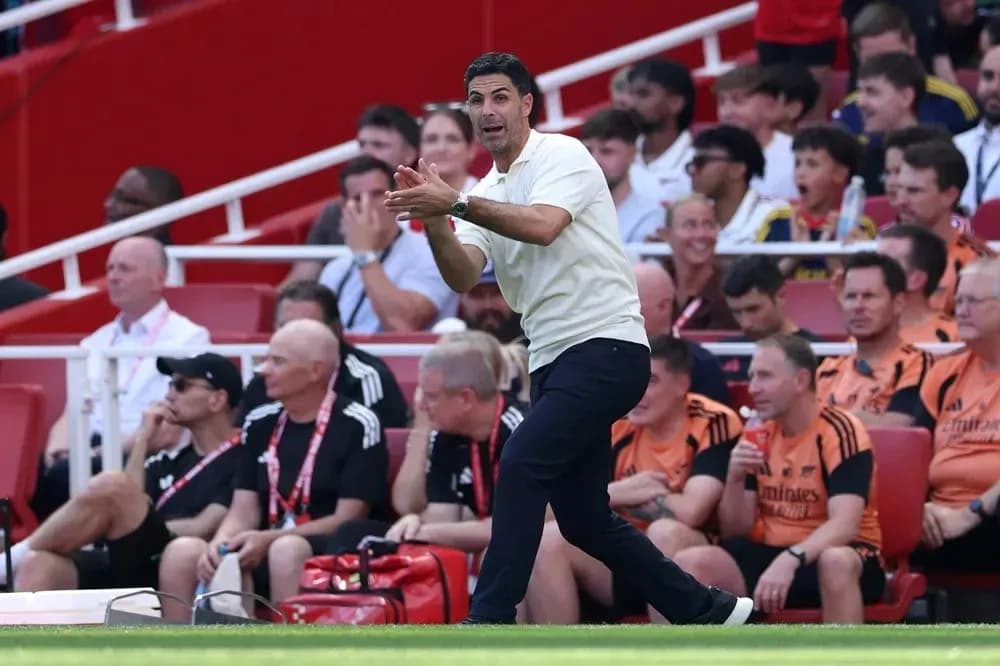 Manager directing players from the sidelines during match