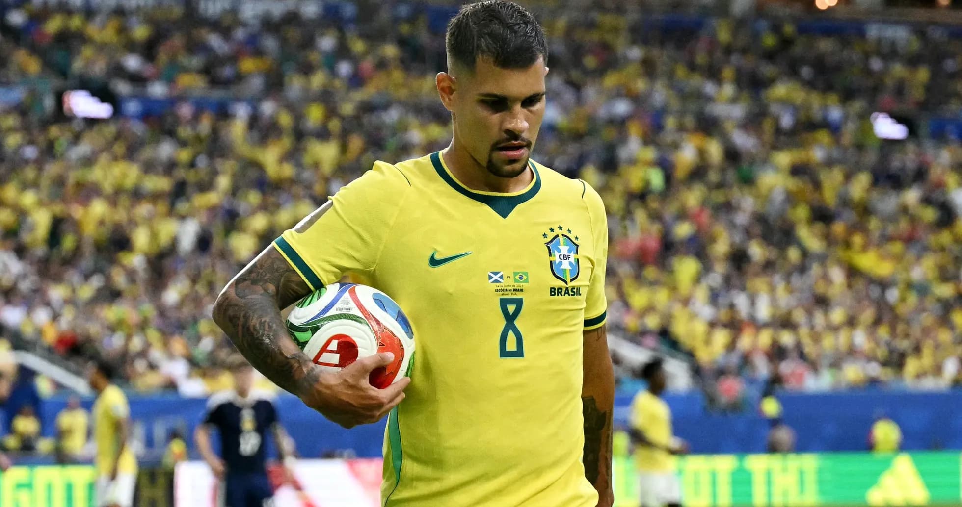 Brazilian player holding ball during match