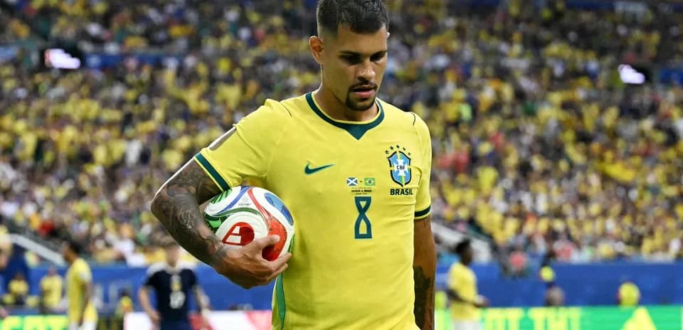 Brazilian player holding ball during match