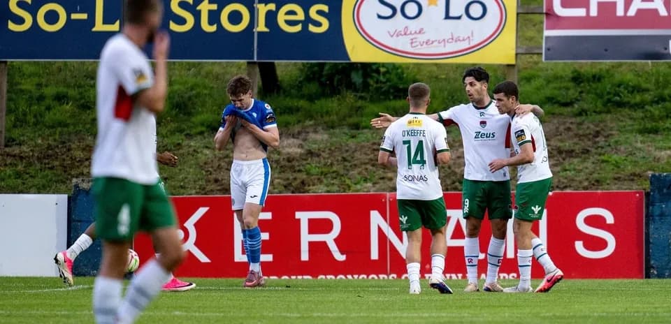 Players celebrating a goal during a football match