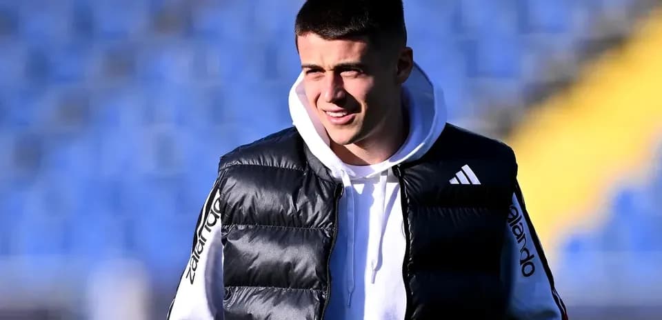 Player in training gear smiling on the field