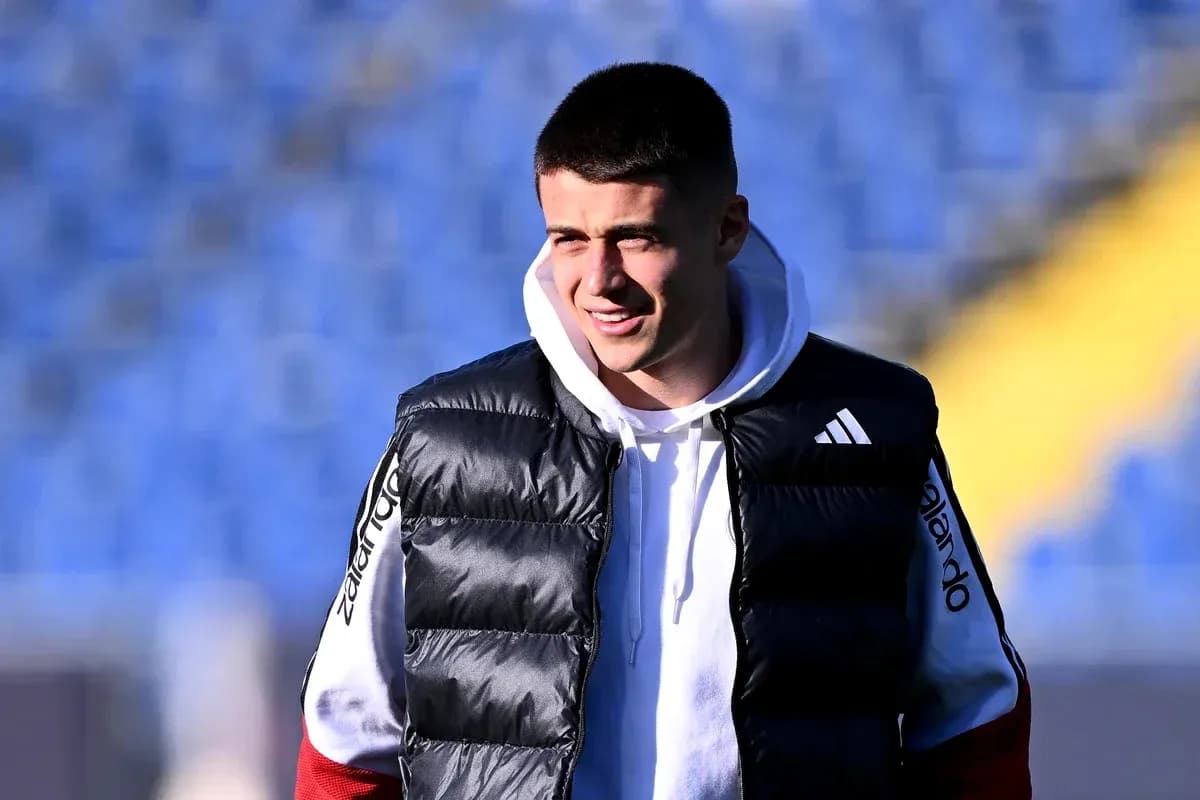 Player in training gear smiling on the field