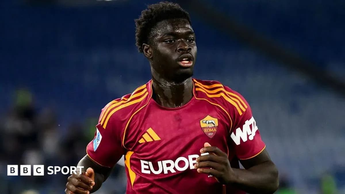 Player in AS Roma kit running during match