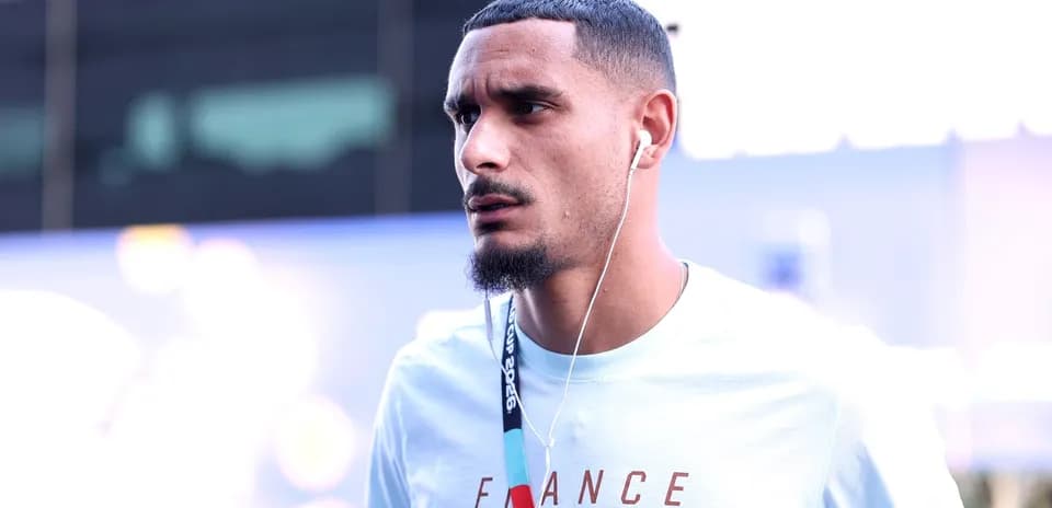 Player walking with headphones before match
