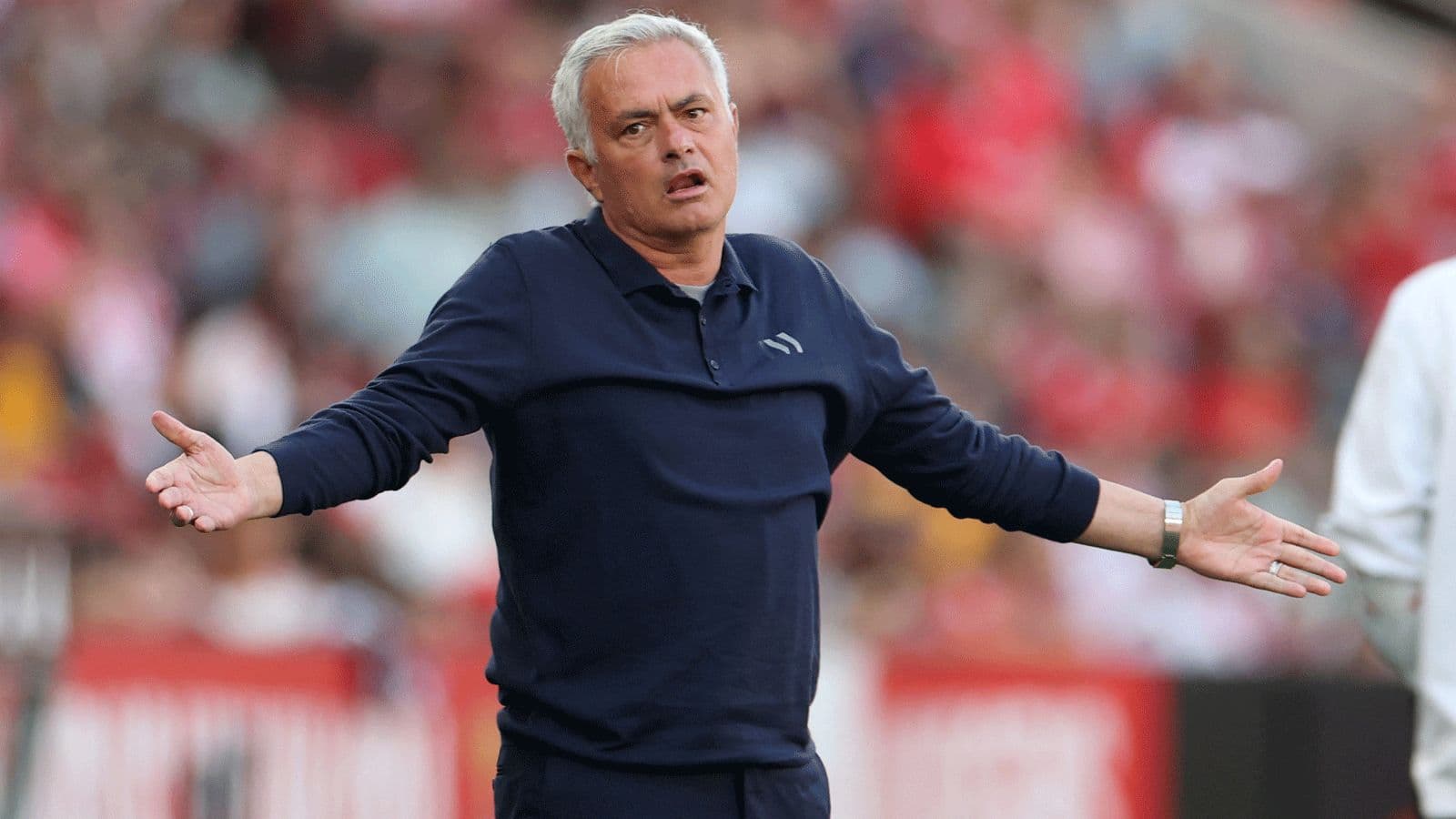 Manager gesturing during a football match