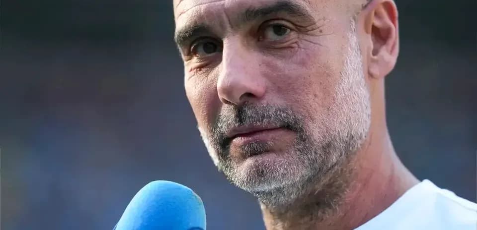 Coach speaking into a microphone during interview