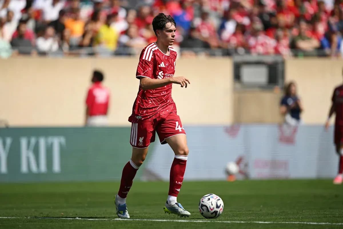 Liverpool player running with ball during match