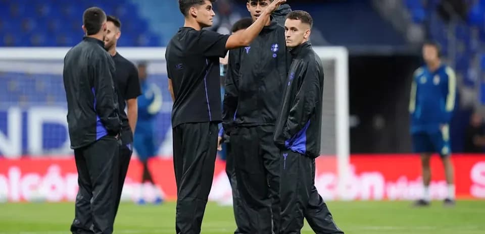 Players discussing strategies on the training pitch