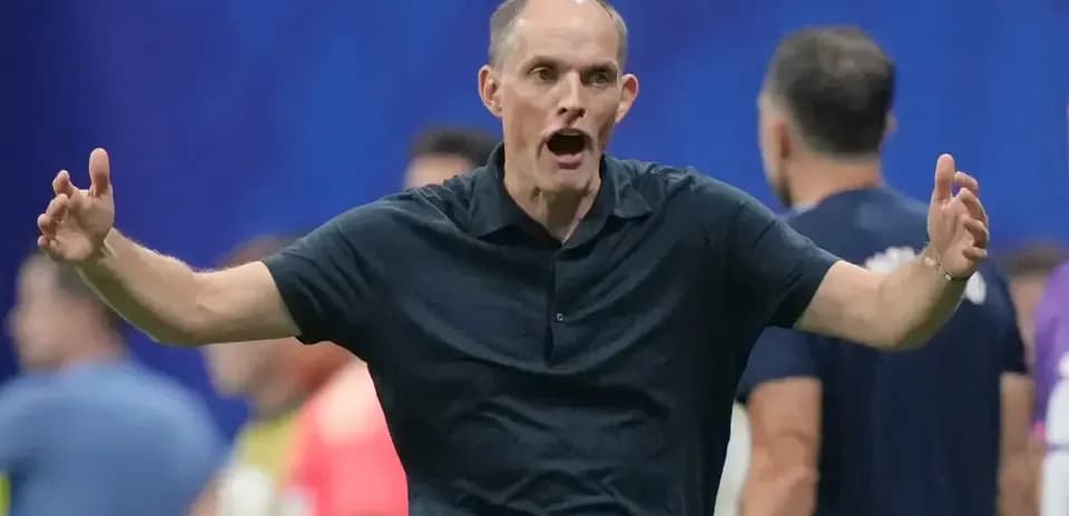 Coach gesturing during a match from the sidelines
