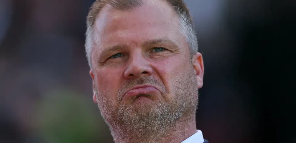 Man with a serious expression during a match