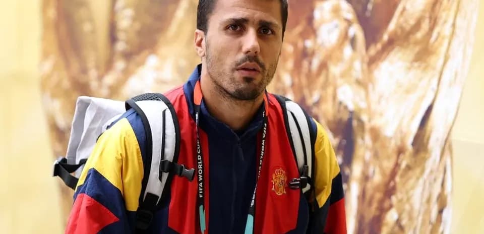 Athlete wearing Spain team jacket at event
