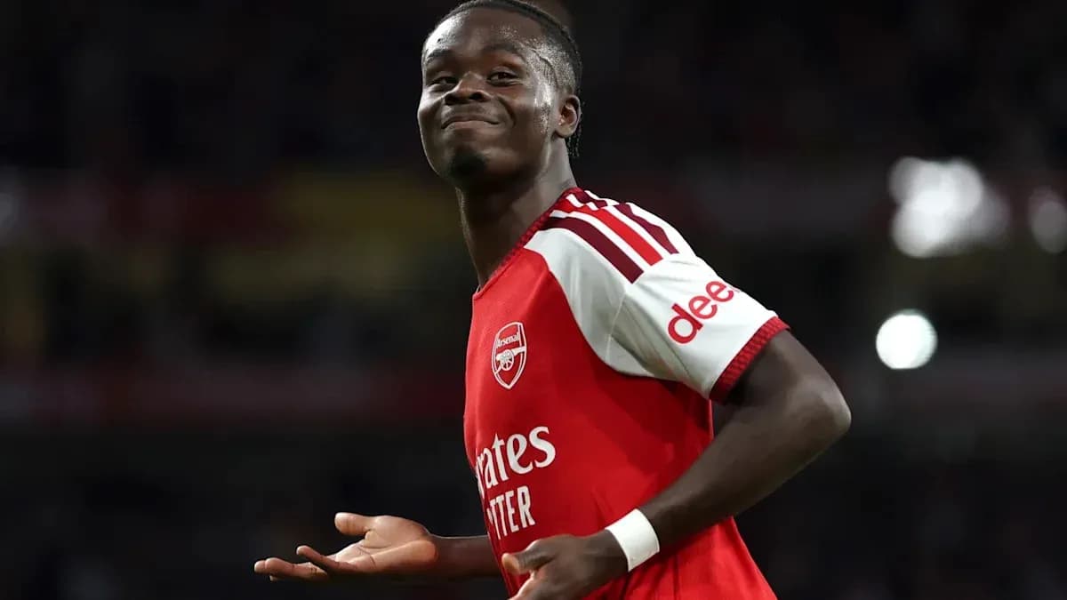 Player celebrating in Arsenal jersey during match