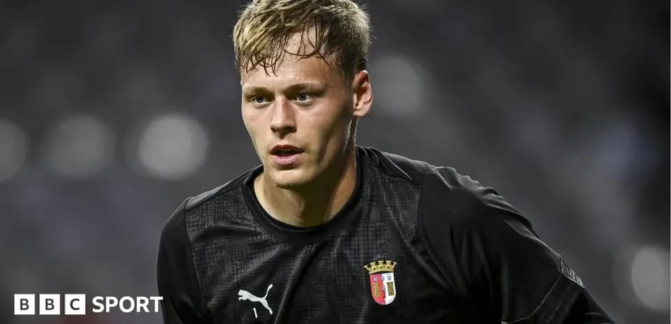 Goalkeeper in black kit during warm-up