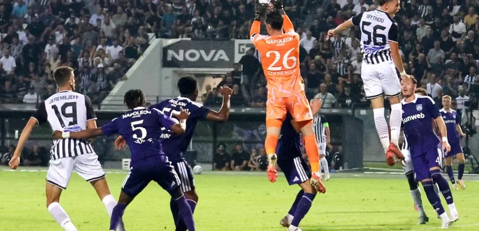 Goalkeeper catching the ball during PAOK match