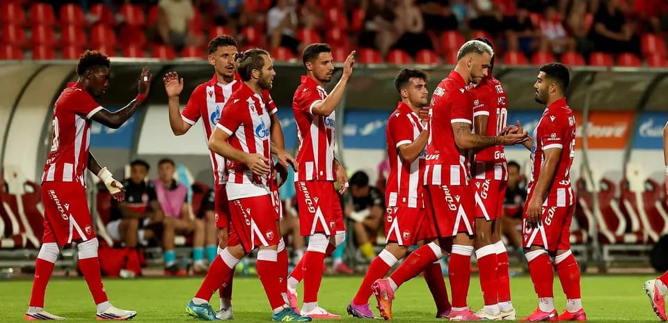 Players celebrating after a goal during match