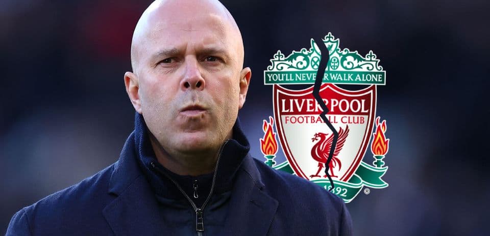 Coach standing in front of Liverpool FC logo