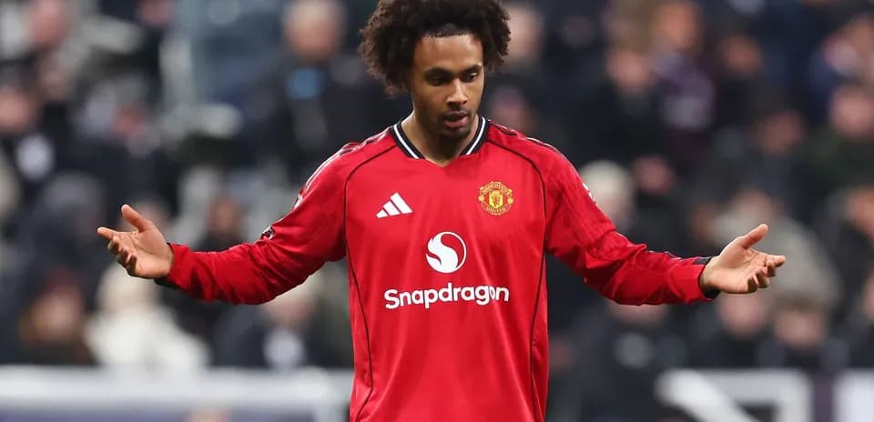 Player in red jersey gesturing during match