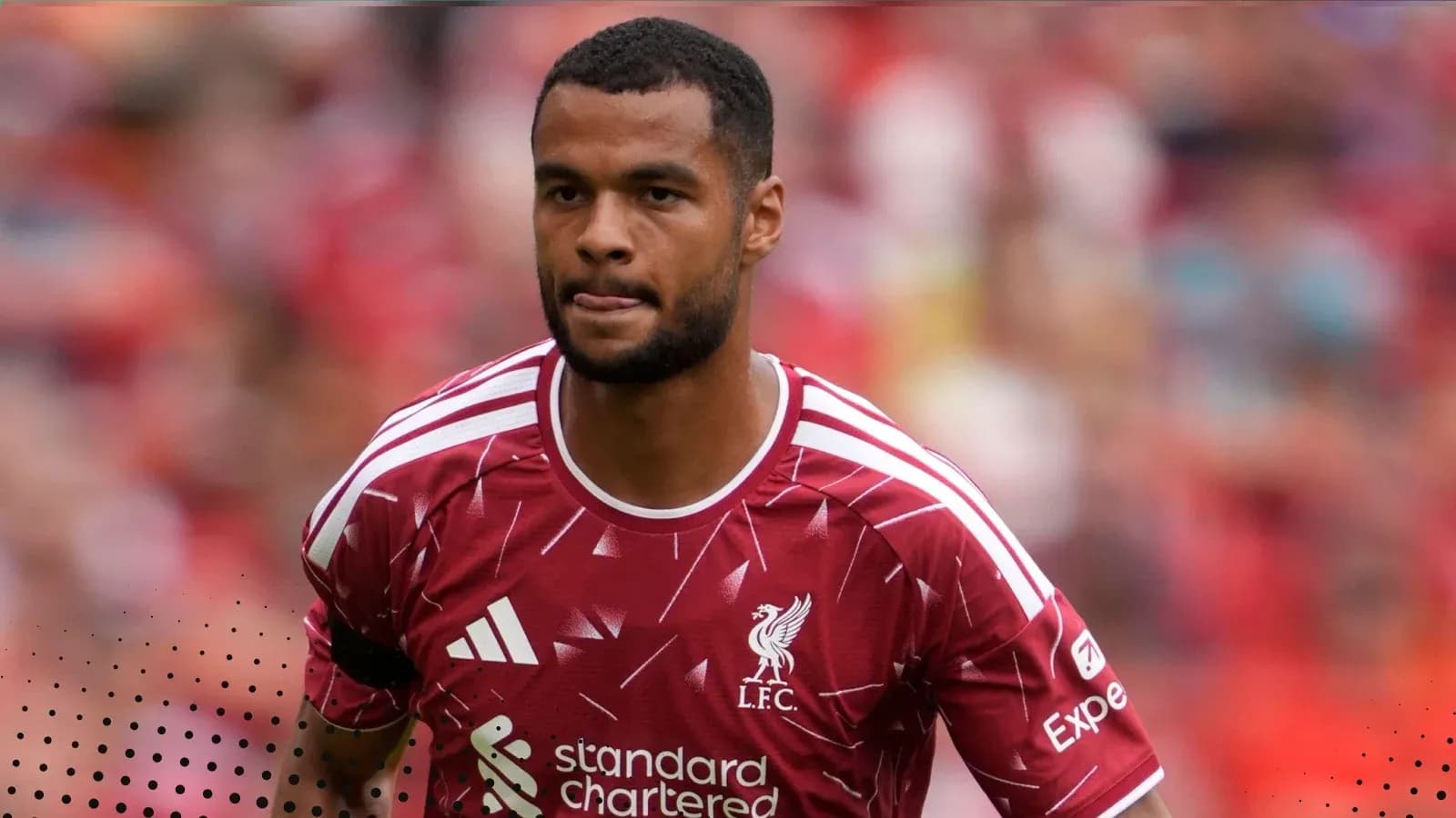 Player in Liverpool kit during match warm-up