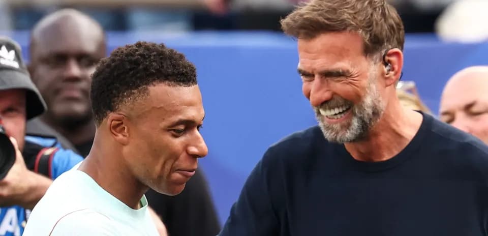 Kylian Mbappé and Jurgen Klopp sharing a moment