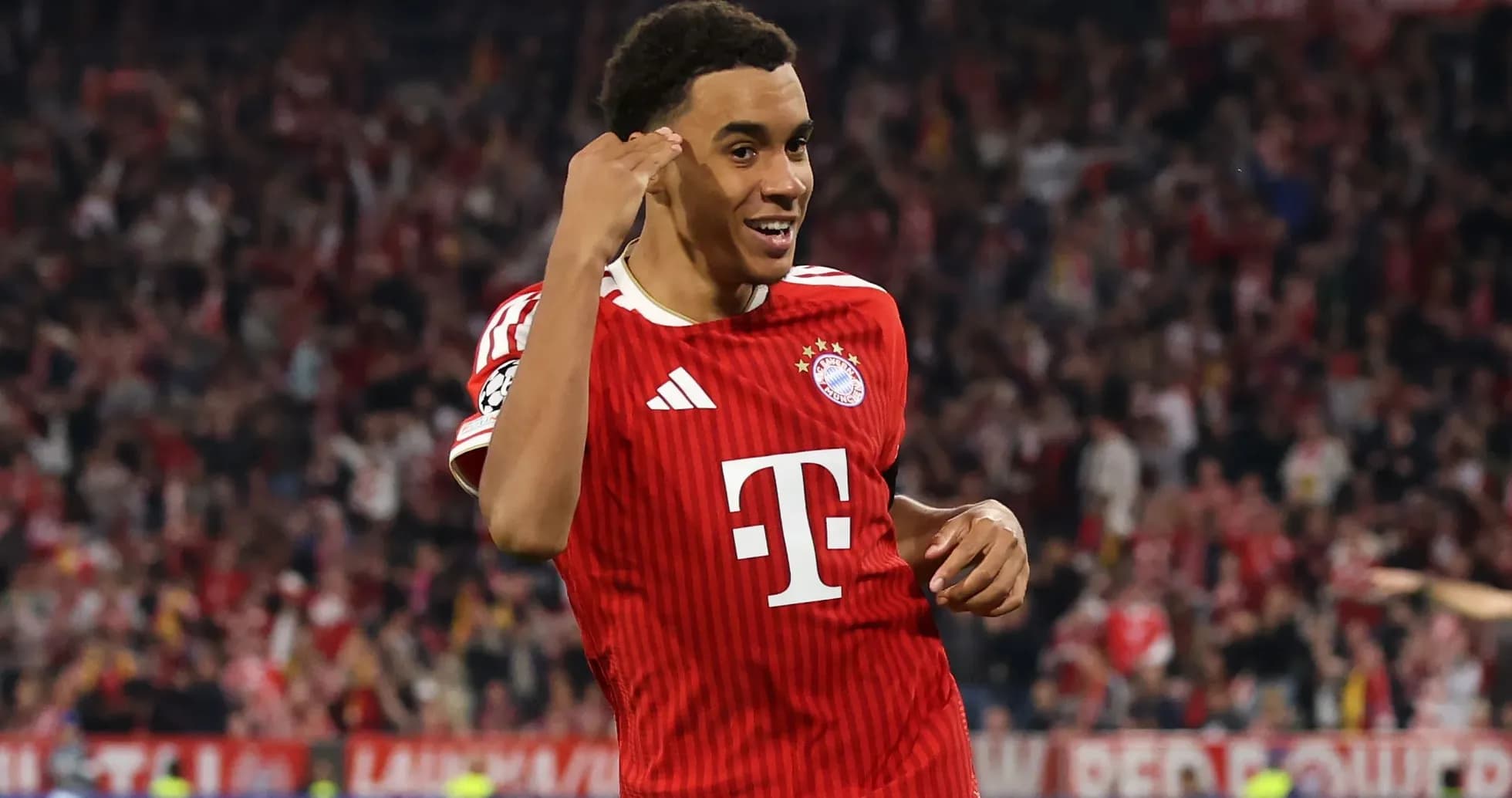 Bayern Munich player celebrating a goal in stadium