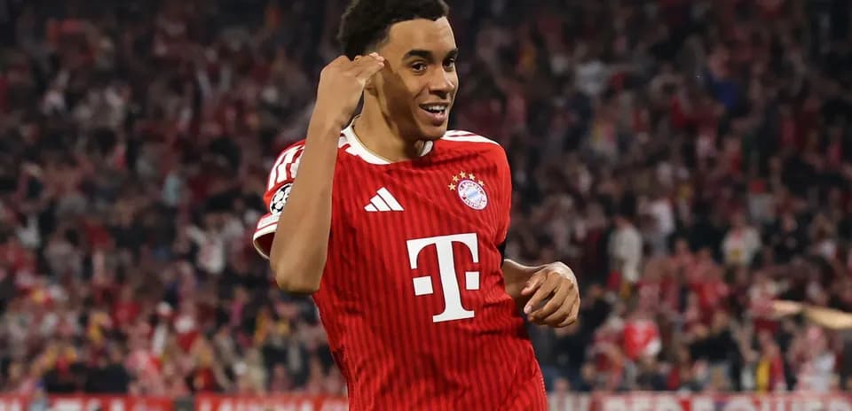 Bayern Munich player celebrating a goal in stadium