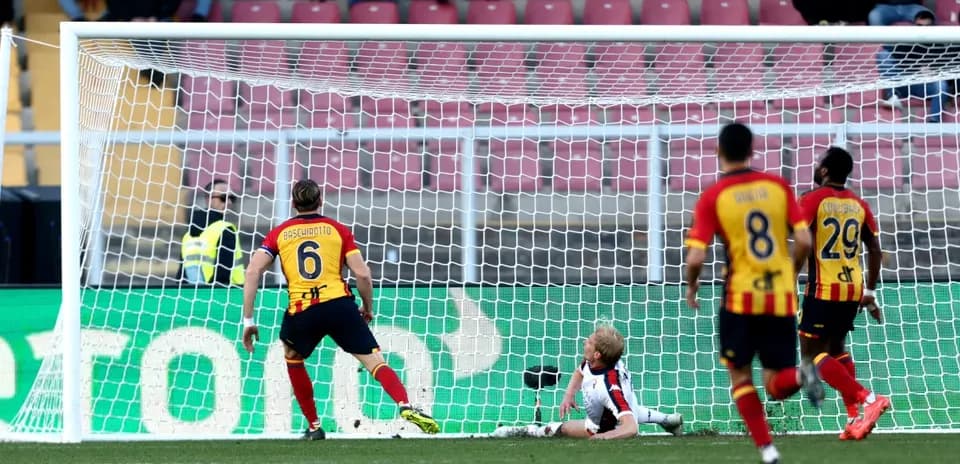Lecce player scoring a goal against Genoa