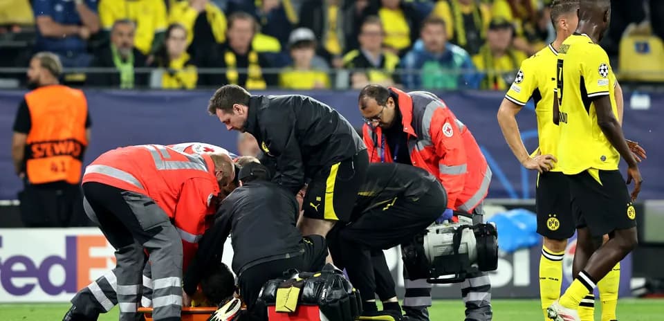 Medical team attending to injured player on field