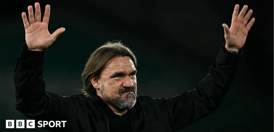Manager gesturing during a match celebration