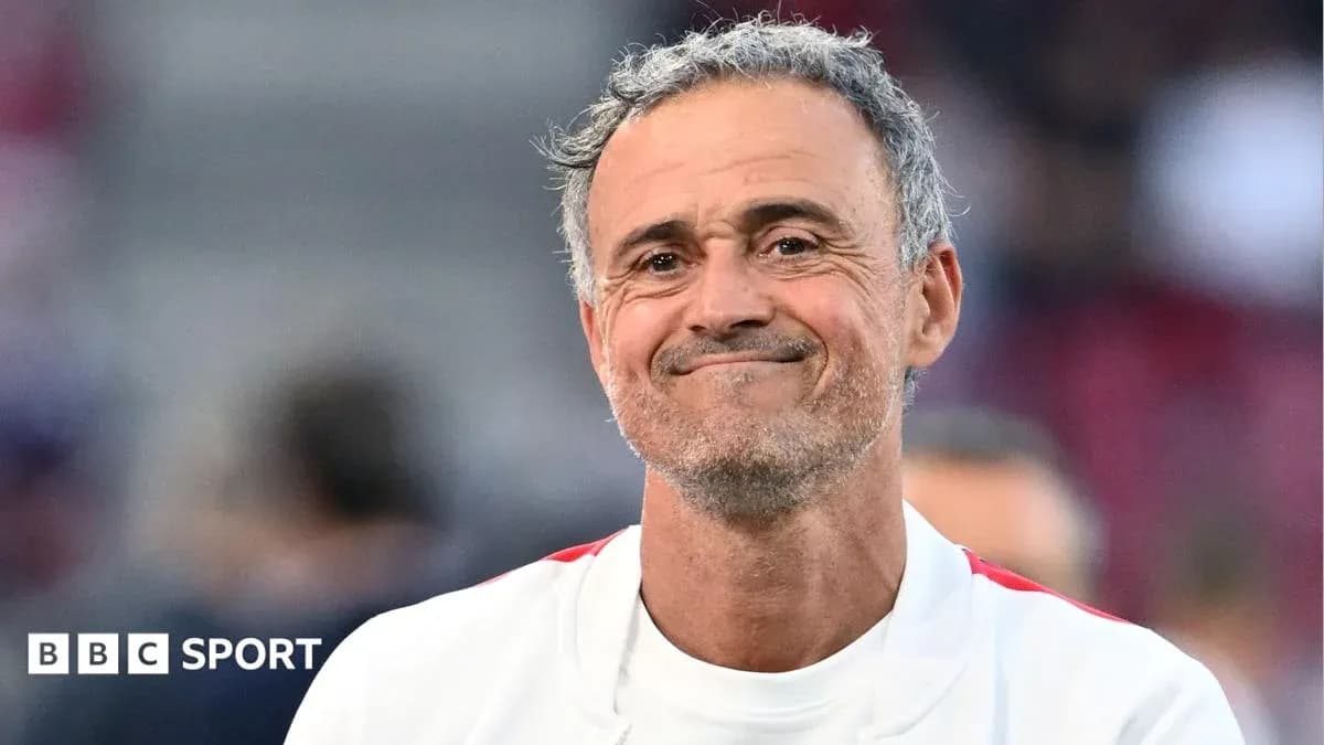 Coach smiling during match warm-up on field