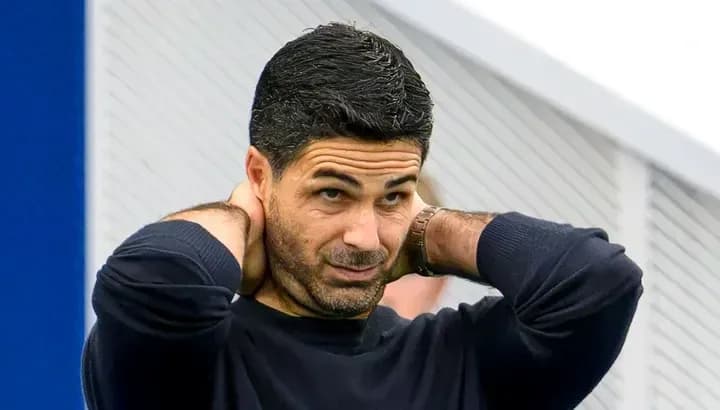 Coach adjusting his hair during training session