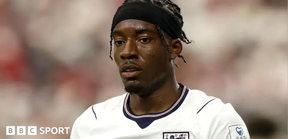 Football player wearing England jersey during match