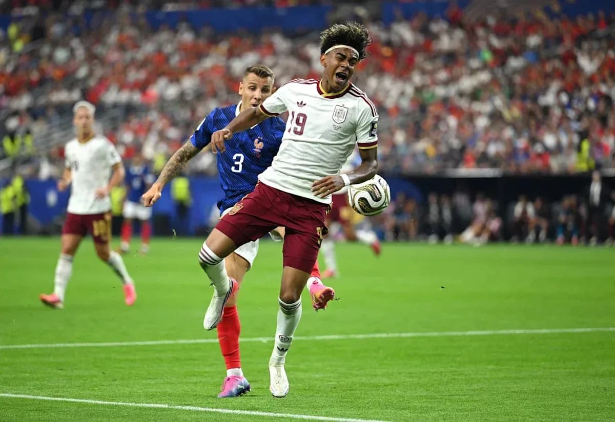 Player 19 from Spain being challenged by French defender