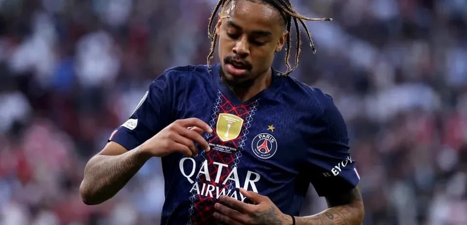 Player adjusting jersey during match for PSG