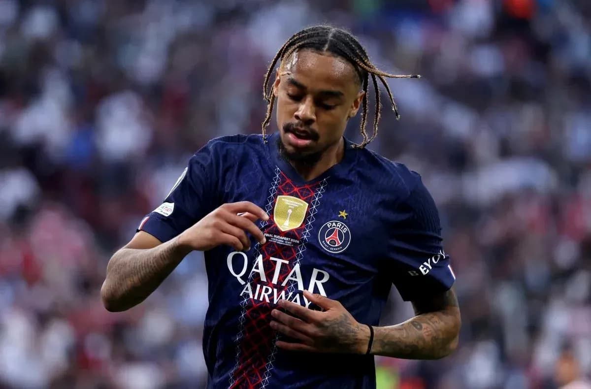 Player adjusting jersey during match for PSG