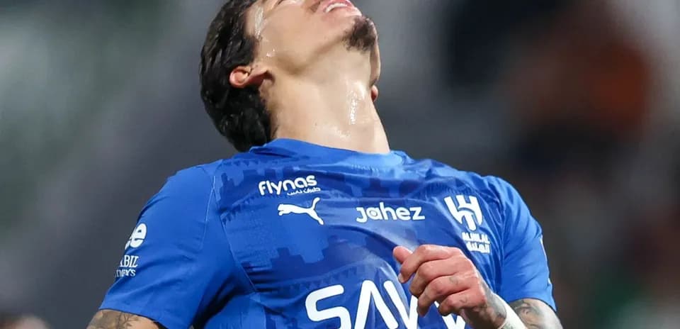 Player in blue jersey reacting during a match