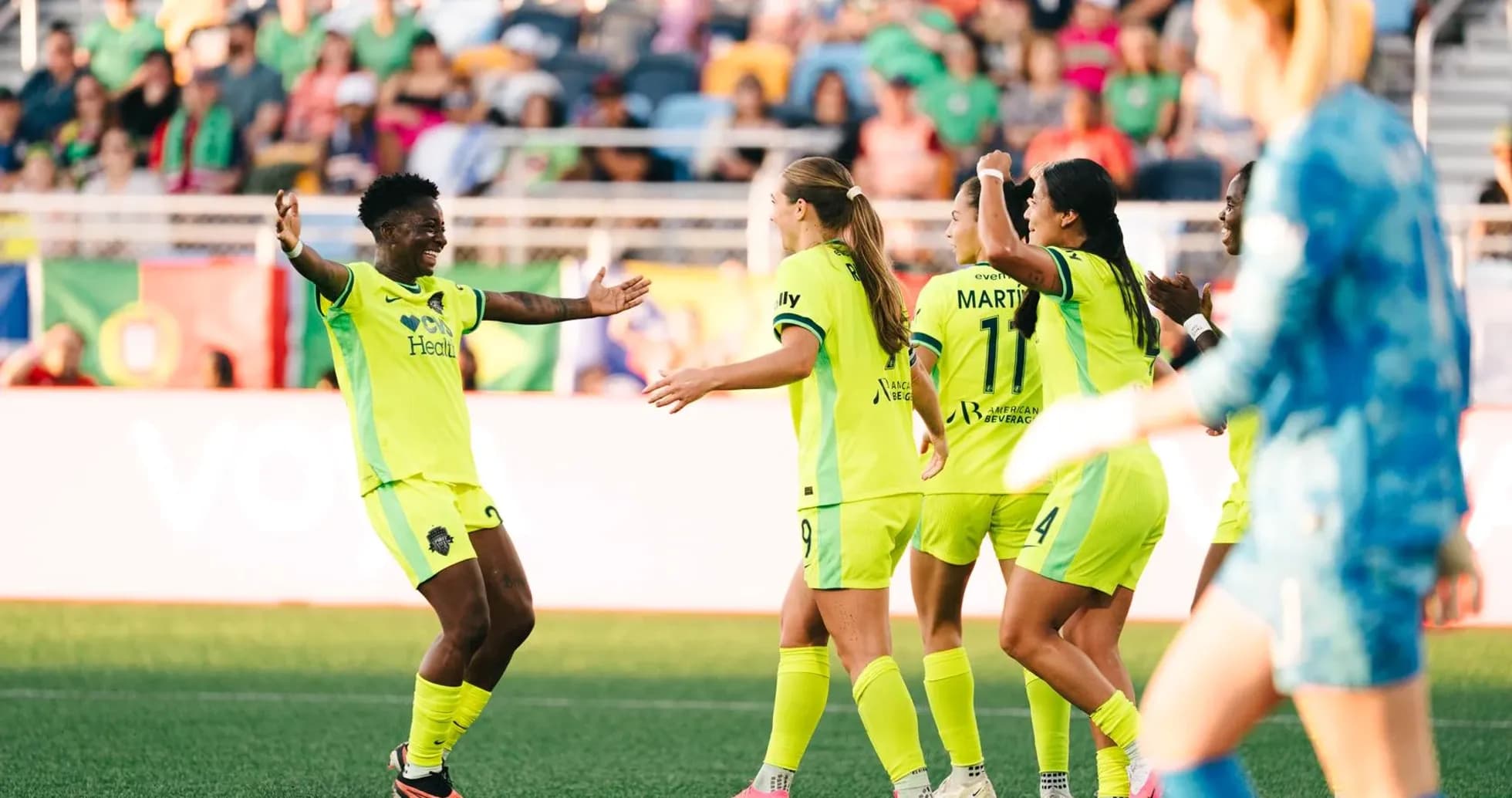 Players celebrating during NWSL match