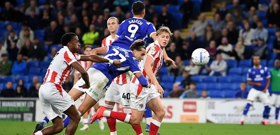 Player attempting a header during a football match