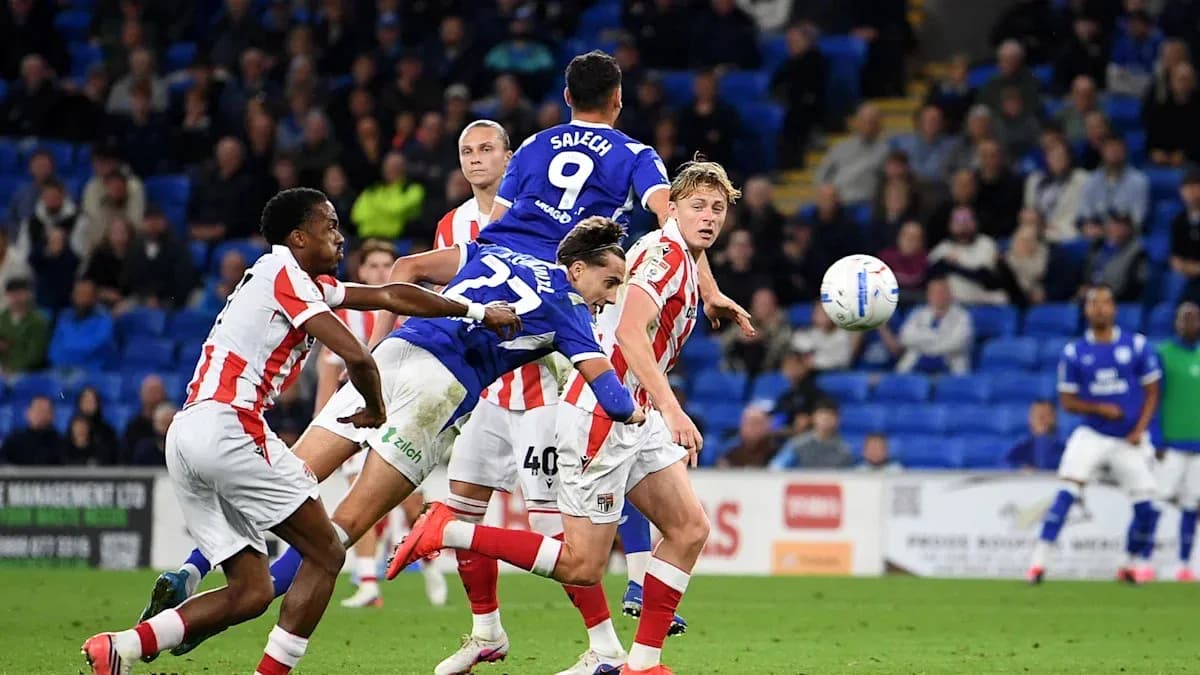 Player attempting a header during a football match