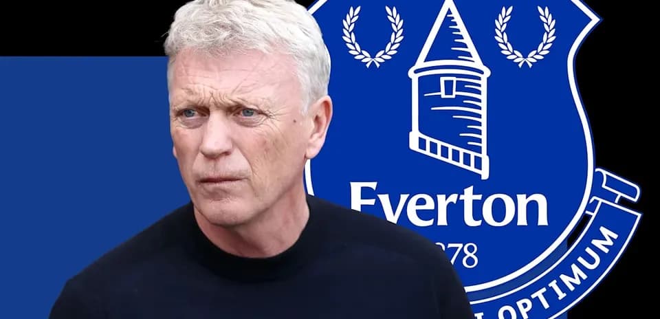 Man in front of Everton FC logo