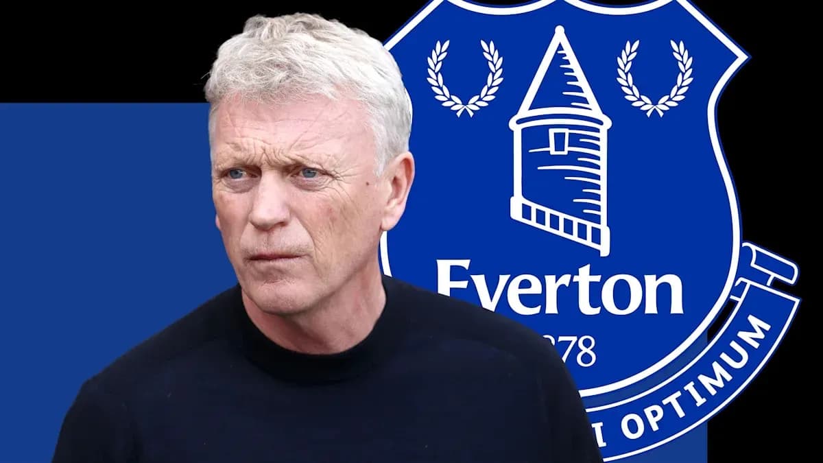 Man in front of Everton FC logo