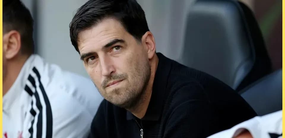 Coach observing the match from the sidelines