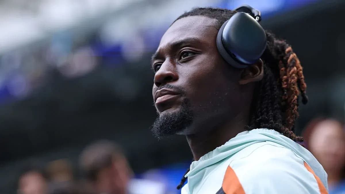 Player wearing headphones during pre-game preparations