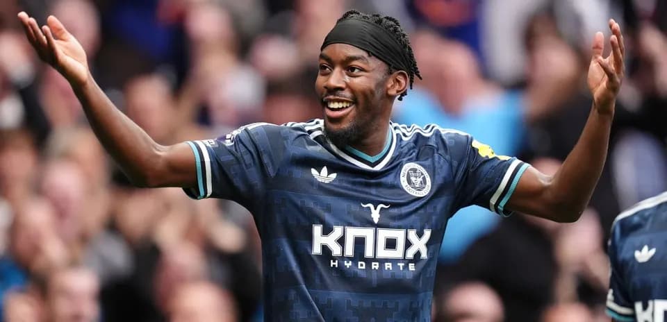 Player celebrating a goal with outstretched arms