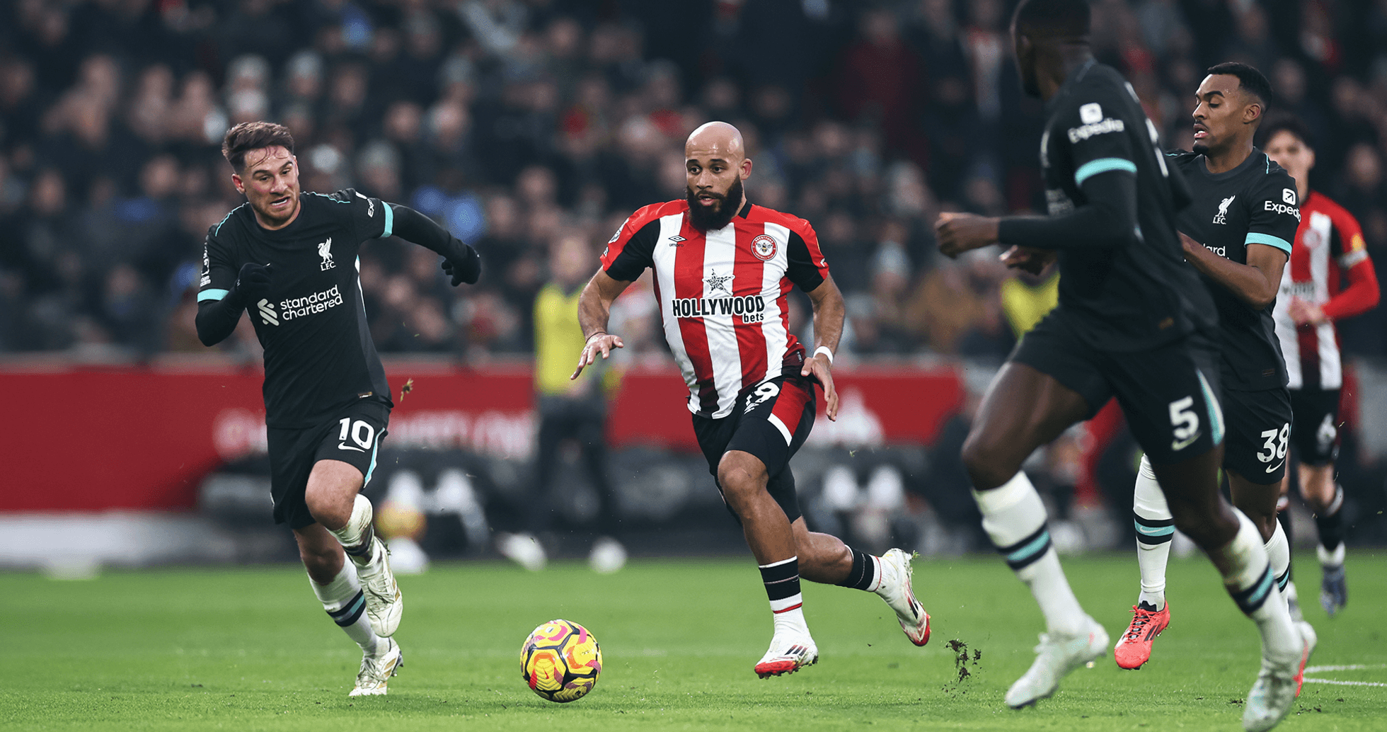 Liverpool player chasing the ball against Brentford