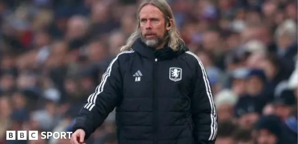 Manager gesturing on the sidelines during a match