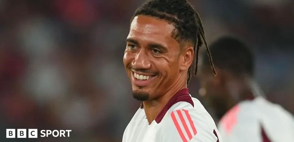 Player smiling during a football match warm-up