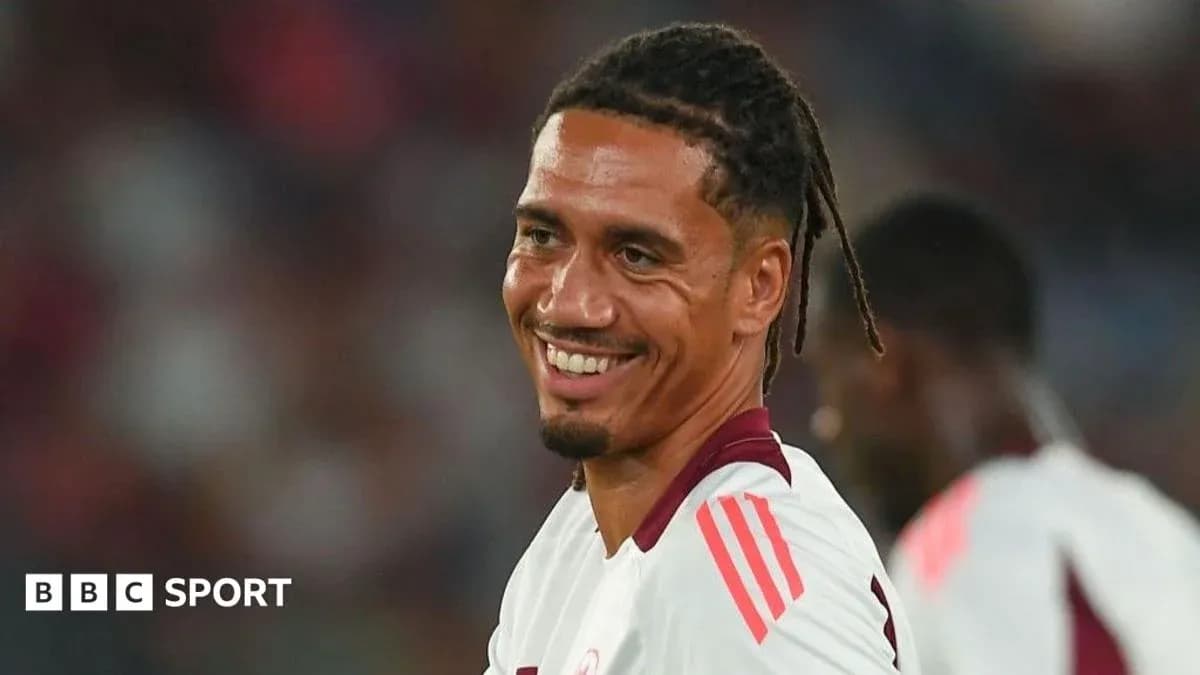 Player smiling during a football match warm-up