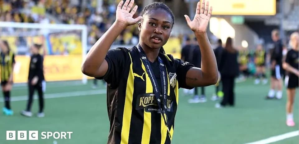 Player waving during post-match celebration on field